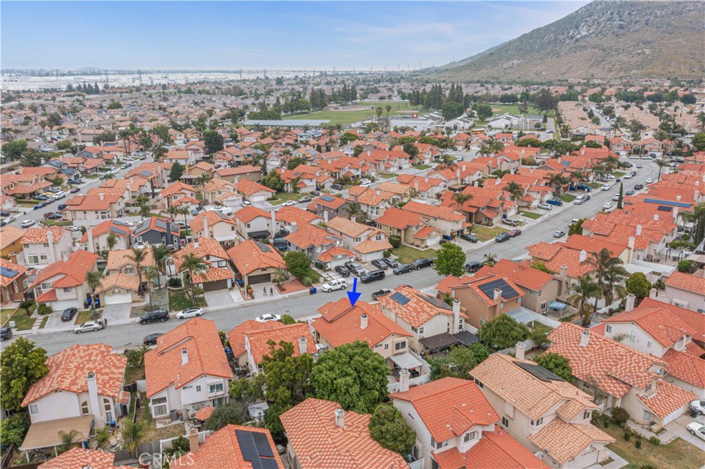 15357 Aveiro Road Fontana, CA 92337 - Photo 1 of 1 an aerial view of residential houses with outdoor space