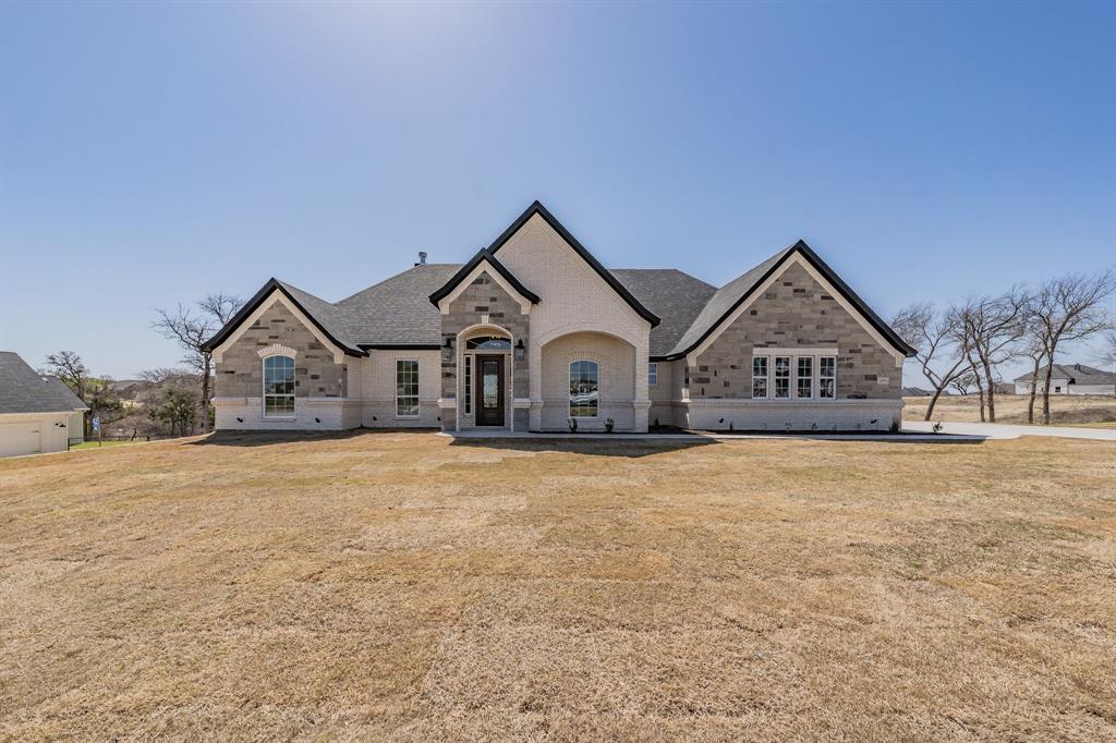119 Coalson Crossing Azle, TX 76020 - Photo 1 of 30 a view of white house with wooden fence and large trees