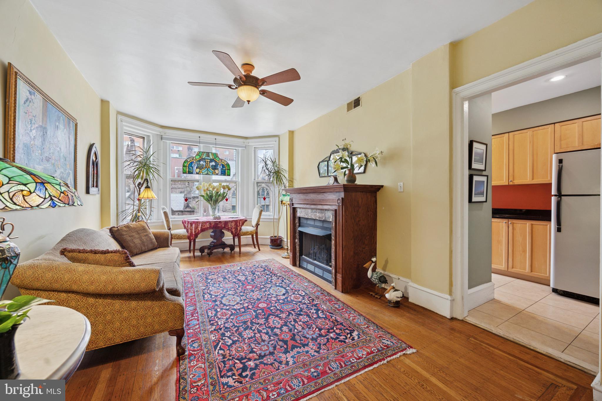 2201 Chestnut Street, Unit 304 Philadelphia, PA 19103 - Photo 11 of 22 a living room with furniture and a fireplace