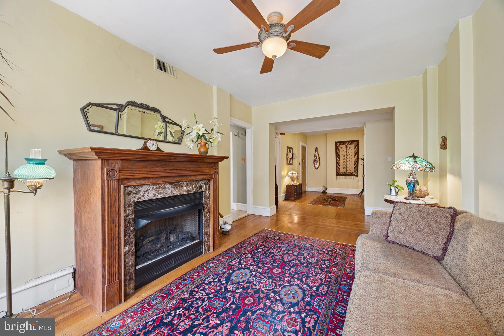 2201 Chestnut Street, Unit 304 Philadelphia, PA 19103 - Photo 12 of 22 a living room with furniture and a fireplace