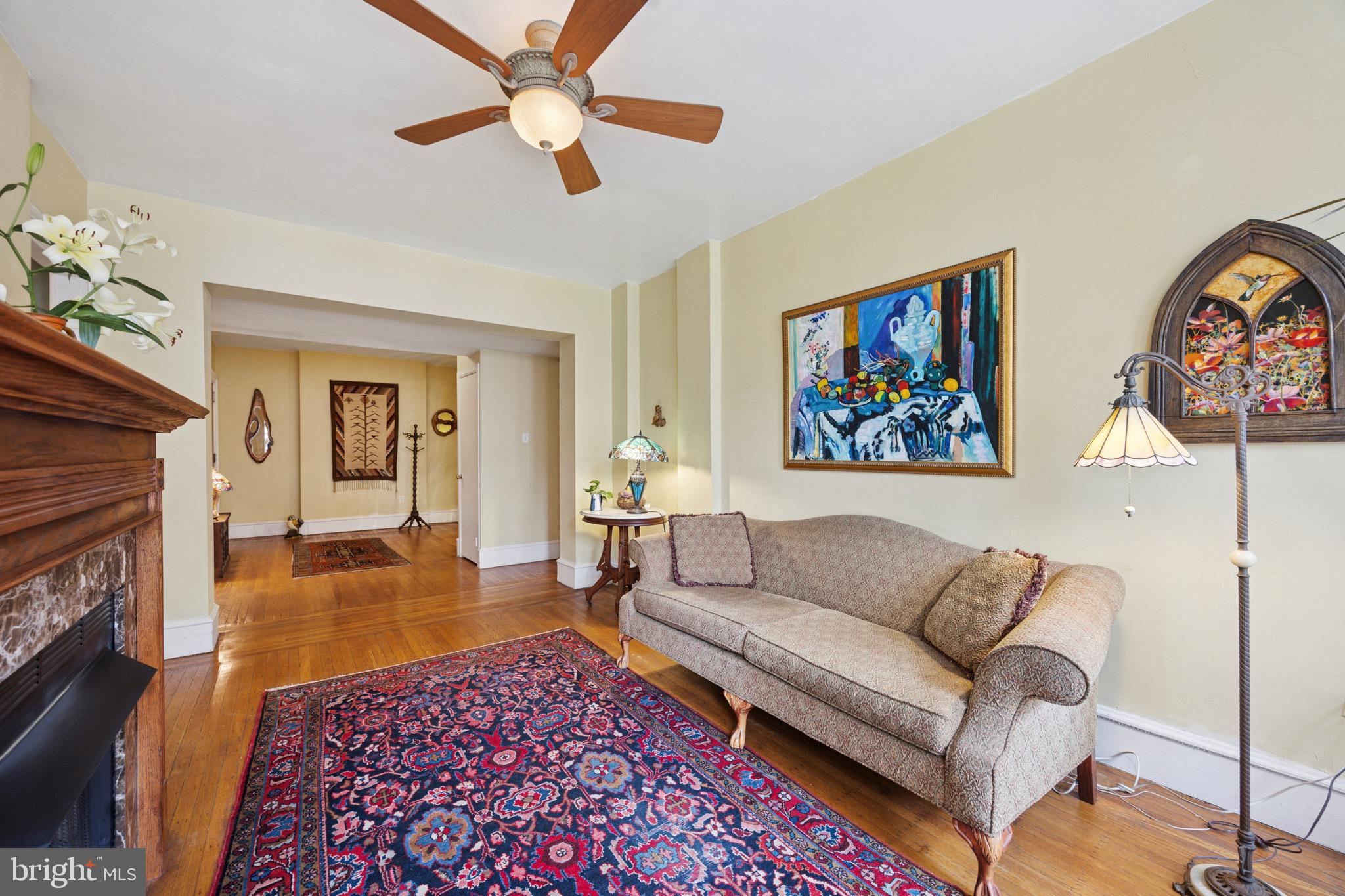 2201 Chestnut Street, Unit 304 Philadelphia, PA 19103 - Photo 13 of 22 a living room with furniture and a fireplace