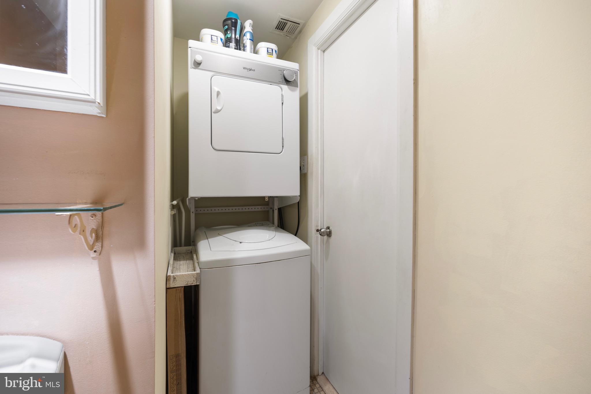 2201 Chestnut Street, Unit 304 Philadelphia, PA 19103 - Photo 15 of 22 a utility room with dryer and washer