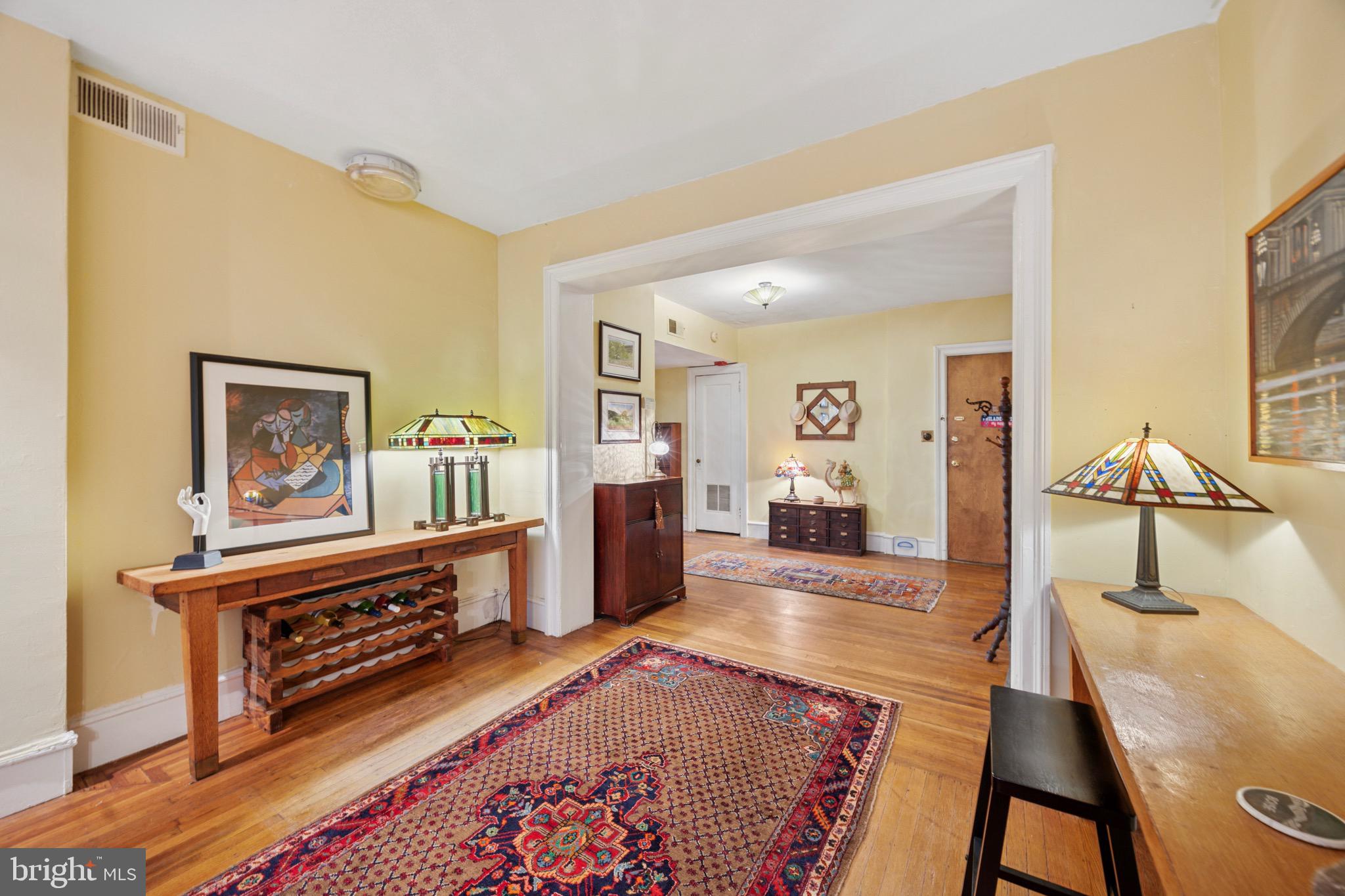 2201 Chestnut Street, Unit 304 Philadelphia, PA 19103 - Photo 5 of 22 a living room with furniture and a flat screen tv