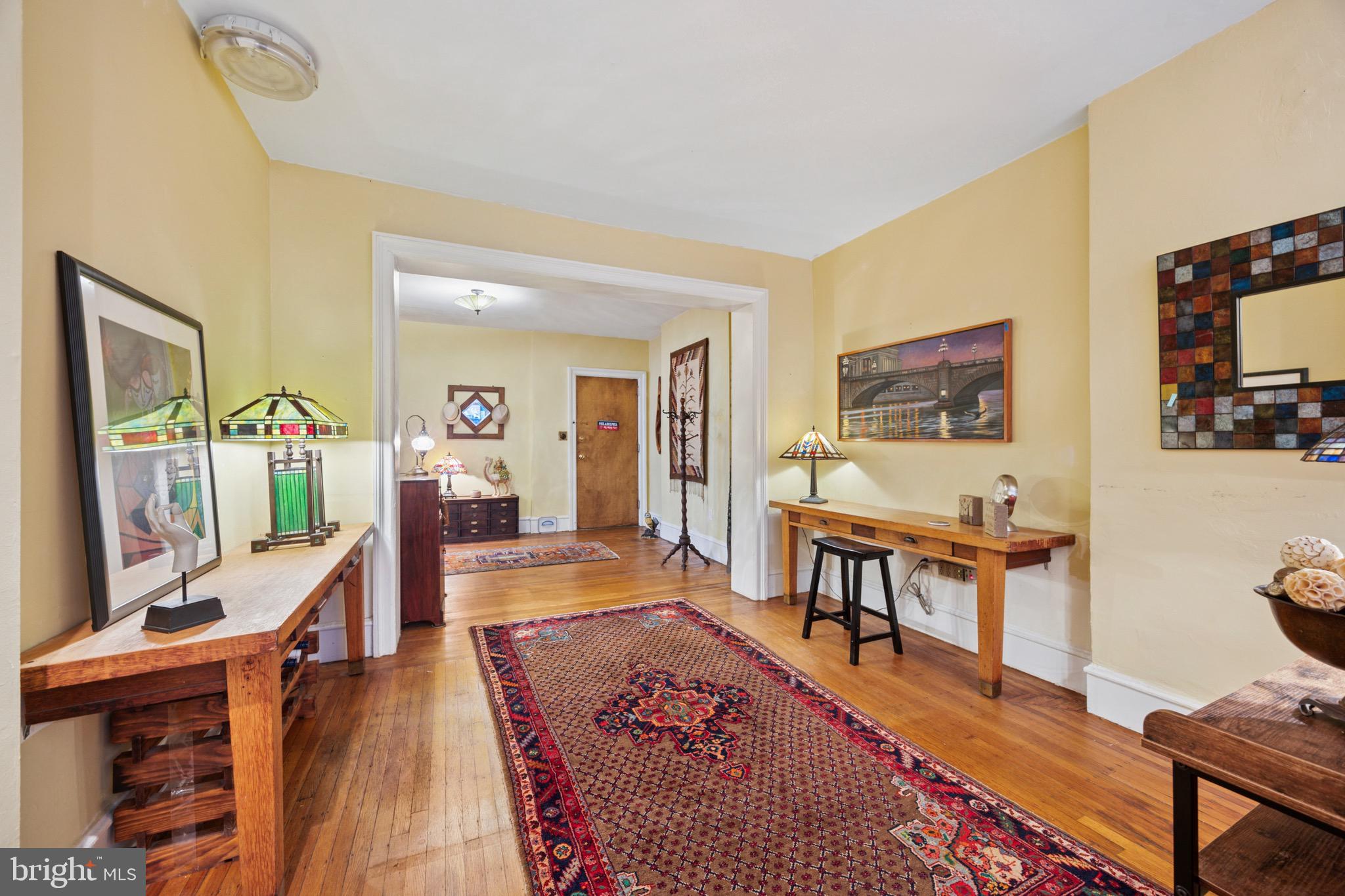 2201 Chestnut Street, Unit 304 Philadelphia, PA 19103 - Photo 6 of 22 a living room with furniture and a wooden floor