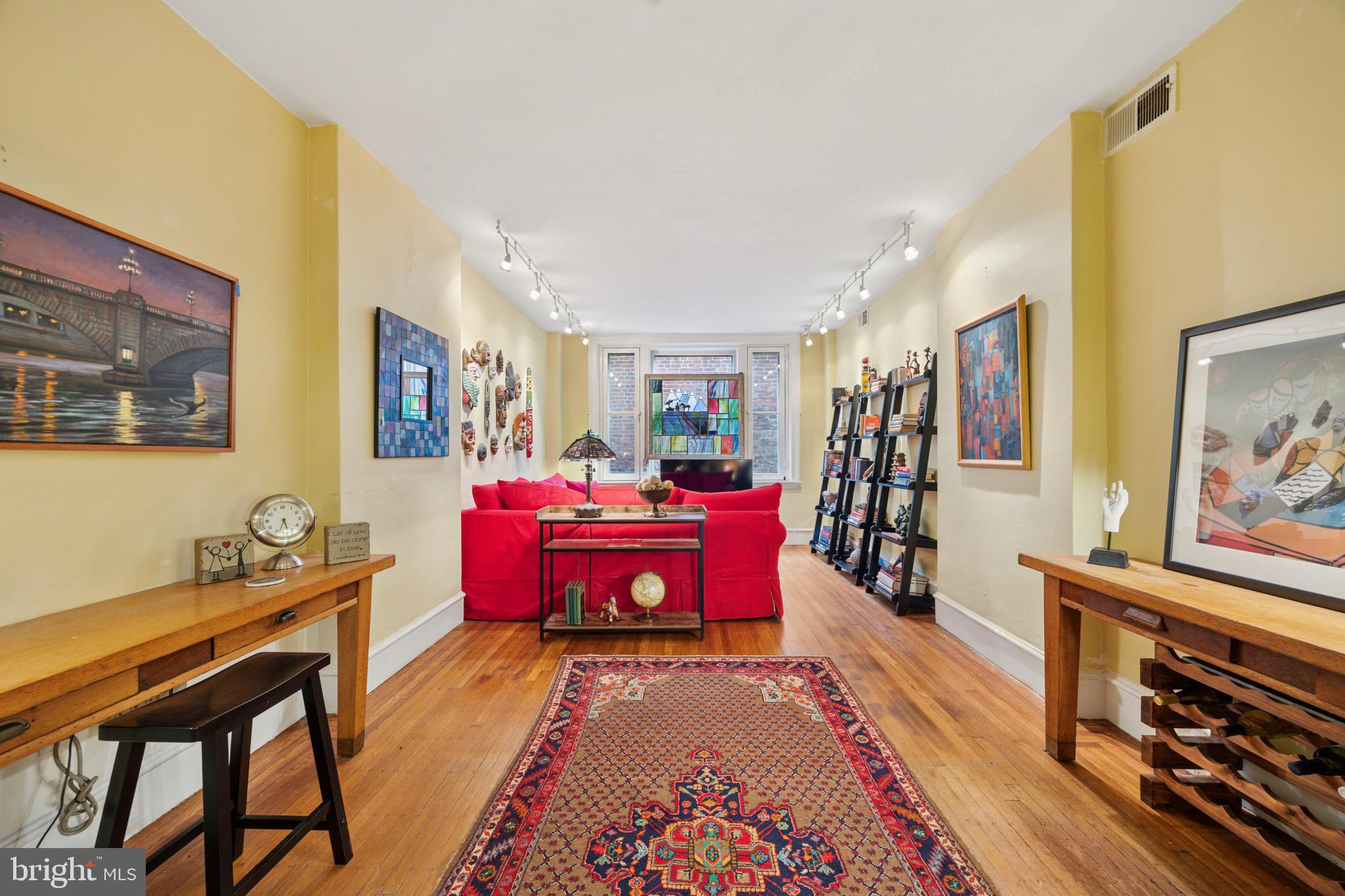 2201 Chestnut Street, Unit 304 Philadelphia, PA 19103 - Photo 7 of 22 a bedroom with furniture and wooden floor