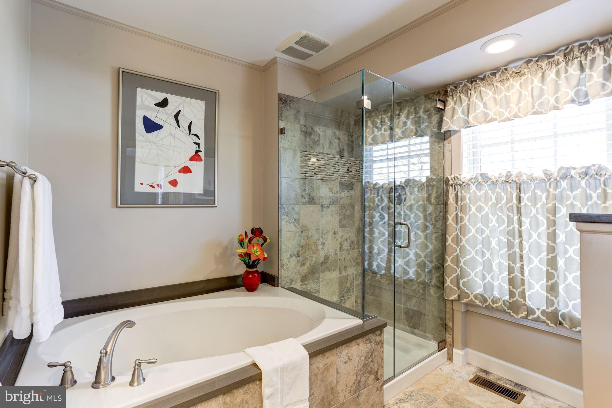 4926 Harrogate Road Ellicott City, MD 21043 - Photo 40 of 52 Porcelain Tiled Tub, Floor + Glass Enclosed Shower
