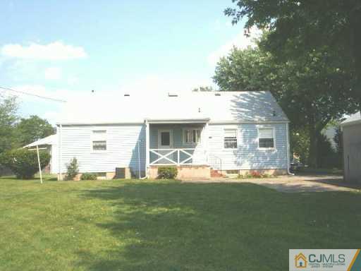 441 Crows Mill Road Fords, NJ 08863 - Photo 3 of 5 a front view of a house with a yard
