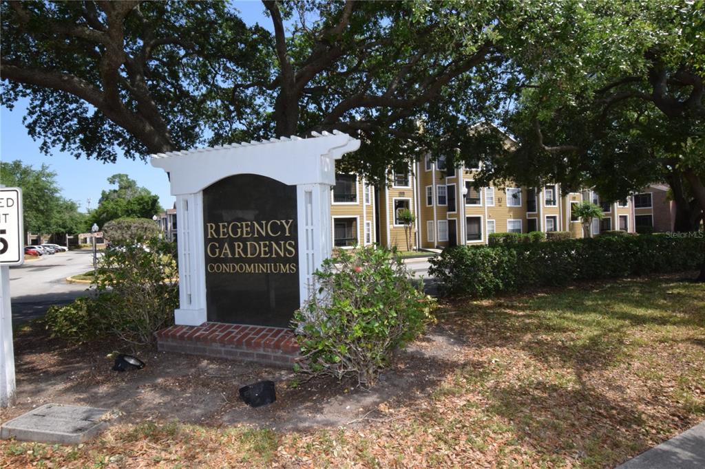 5533 Chrishire Way, Unit F201 Orlando, FL 32822 - Photo 1 of 12 a front view of a house with garden