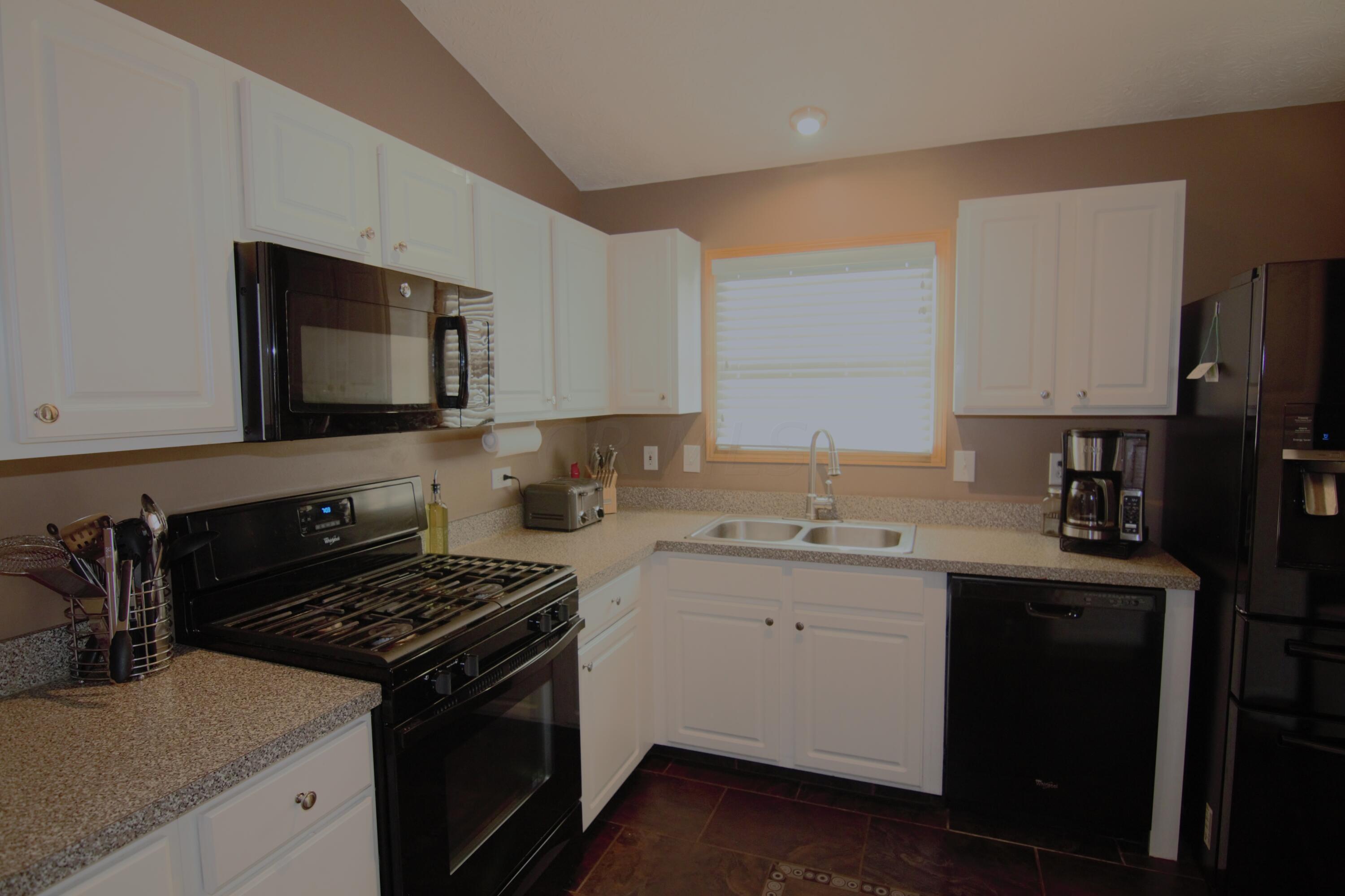 4571 Nickerson Road Columbus, OH 43228 - Photo 14 of 37 The kitchen viewed from next to the stairs.