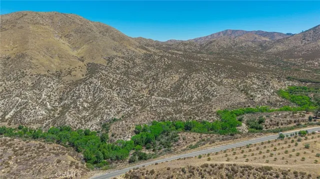 a view of a mountain with a mountain in the background