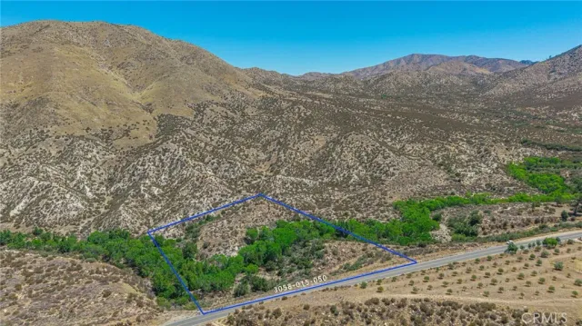 a view of a mountain with a mountain in the background