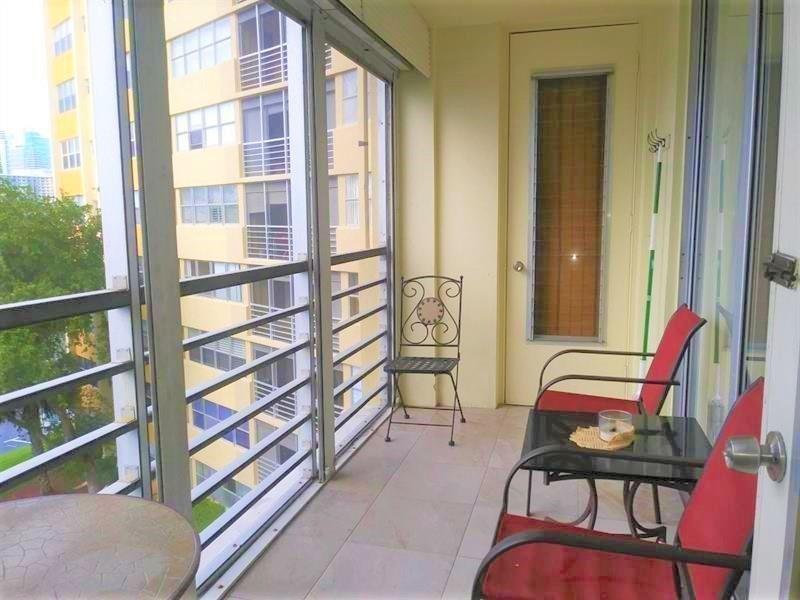 100 Golden Isles Drive, Unit 511 Hallandale Beach, FL 33009 - Photo 13 of 20 a room with furniture and a window