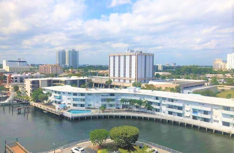 100 Golden Isles Drive, Unit 511 Hallandale Beach, FL 33009 - Photo 14 of 20 a view of a city with lake