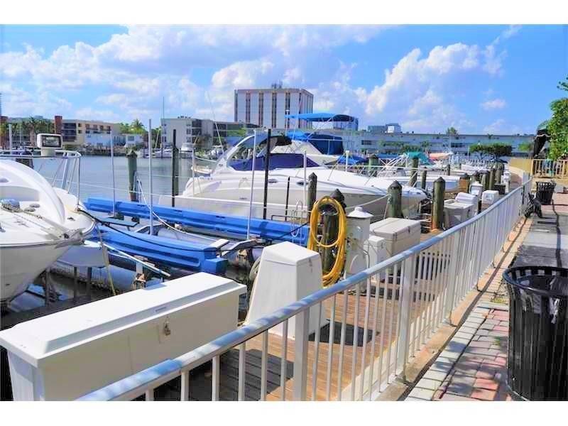 100 Golden Isles Drive, Unit 511 Hallandale Beach, FL 33009 - Photo 15 of 20 a view of a balcony with two chairs