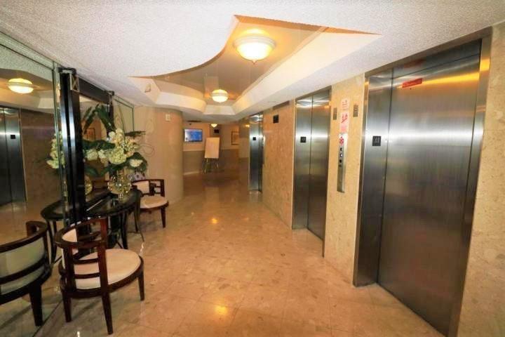 100 Golden Isles Drive, Unit 511 Hallandale Beach, FL 33009 - Photo 19 of 20 a view of entryway wih livingroom and furniture