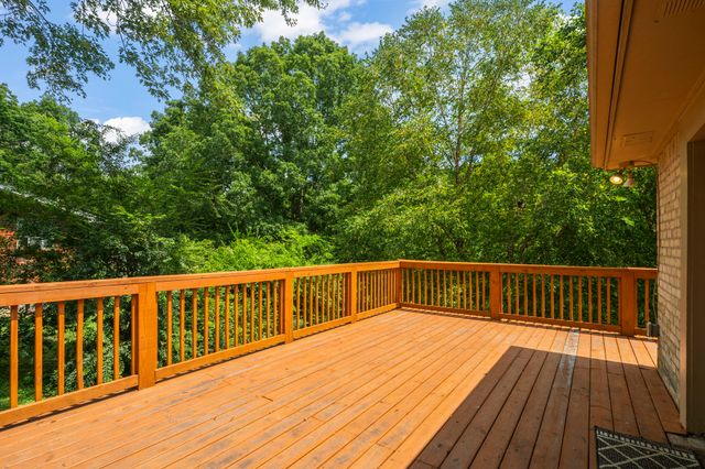 a view of balcony with deck and wooden floor