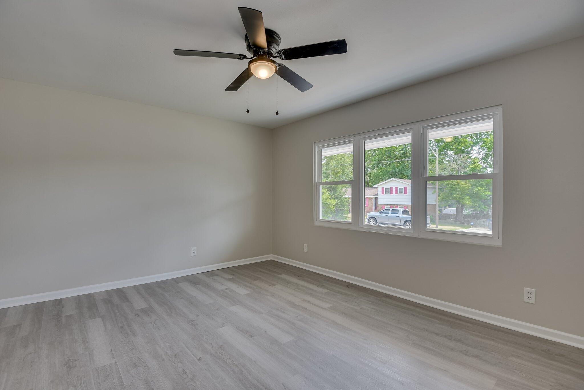 2115 Ashley Drive Augusta, GA 30906 - Photo 8 of 38 an empty room with wooden floor and windows