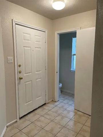 an empty room with closet area