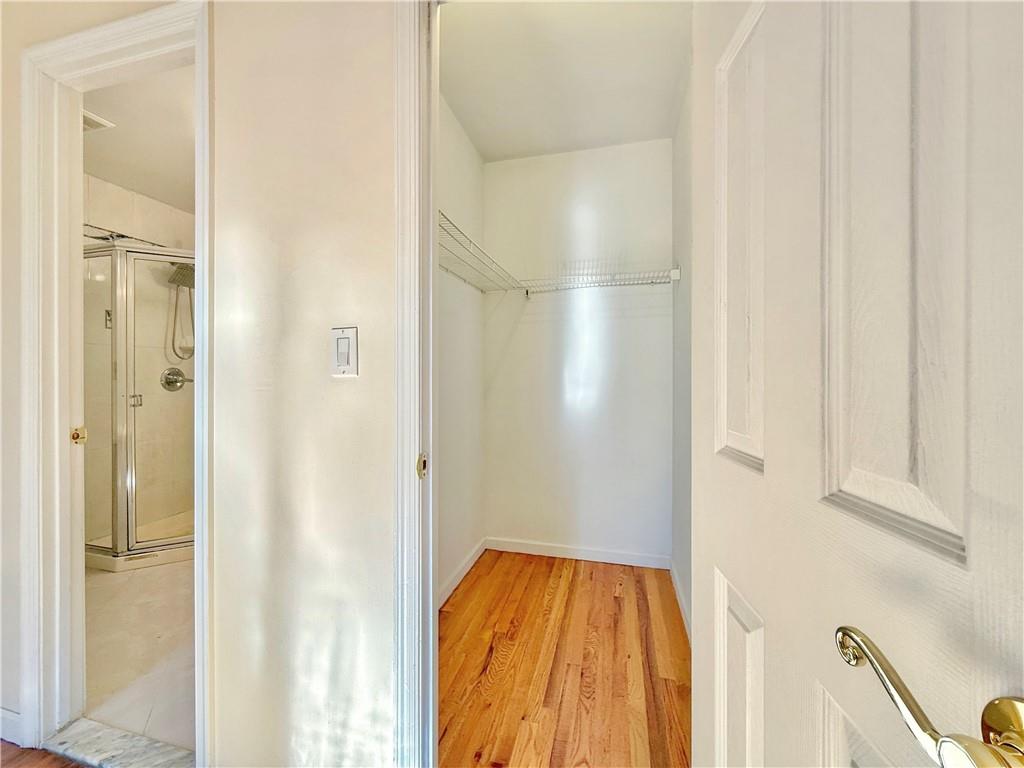 511 68th Street, Unit 2A Brooklyn, NY 11220 - Photo 17 of 19 a bathroom with a bathtub and shower