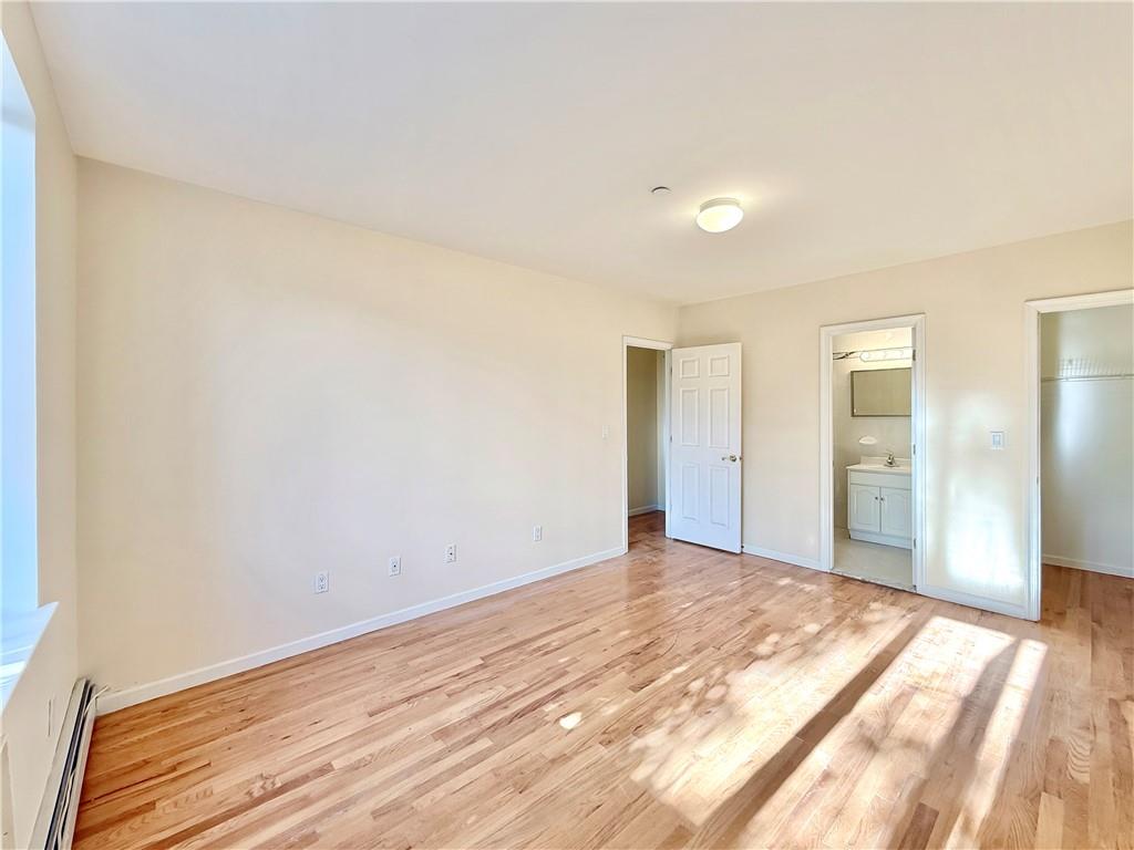 511 68th Street, Unit 2A Brooklyn, NY 11220 - Photo 10 of 19 a view of an empty room and wooden floor