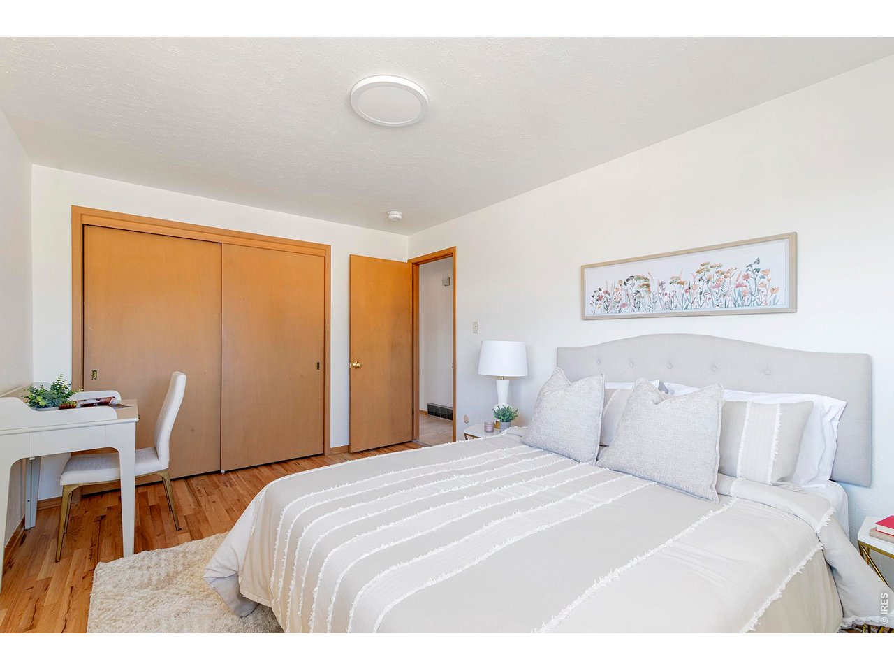 2410 Grape Avenue Boulder, CO 80304 - Photo 25 of 50 Secondary bedroom 2 featuring a spacious double closet, refinished hardwood floors, and fresh paint that brightens and refreshes the room.