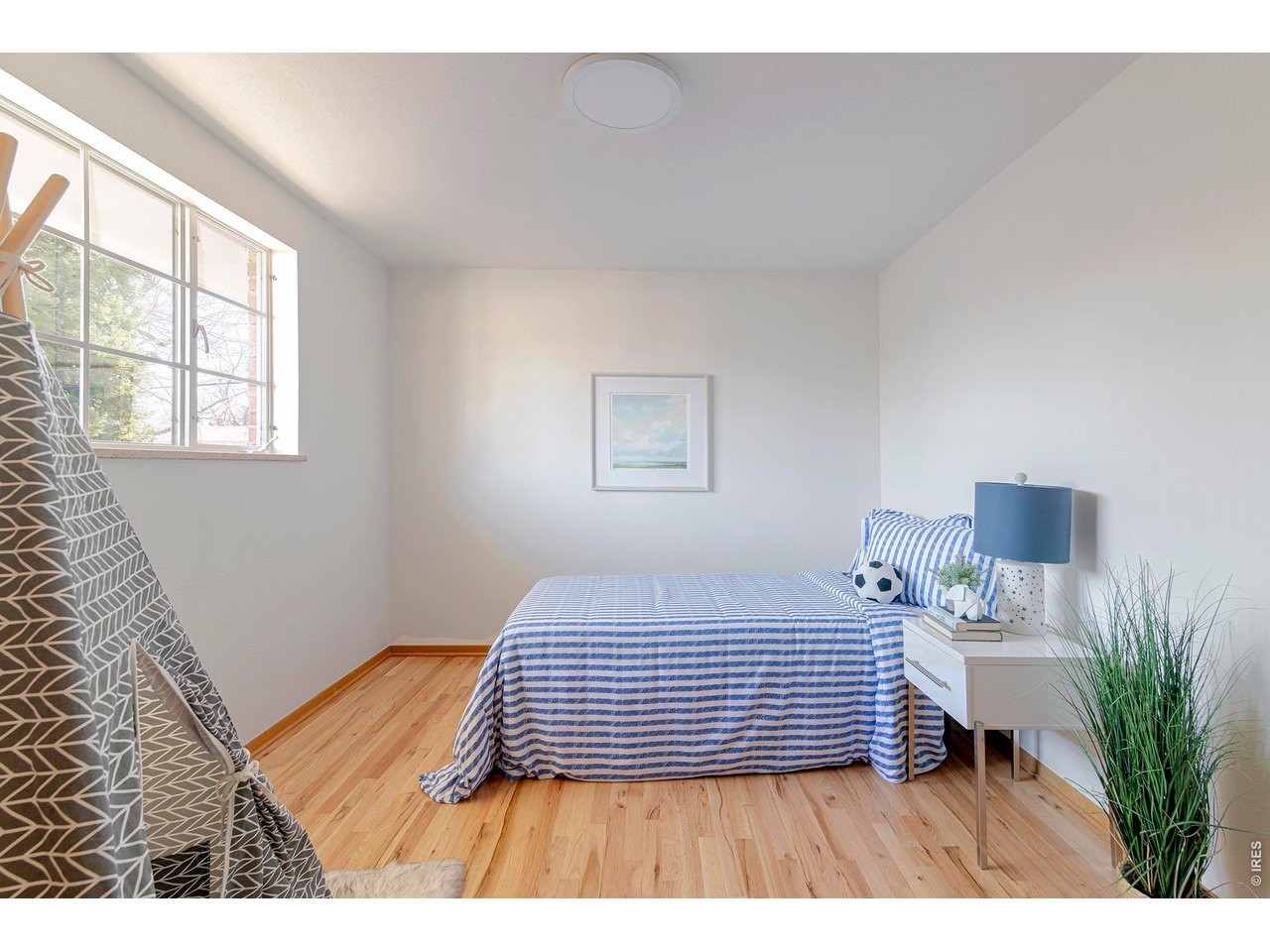 2410 Grape Avenue Boulder, CO 80304 - Photo 27 of 50 Secondary bedroom 3 featuring a spacious double closet, refinished hardwood floors, and fresh paint that brightens and refreshes the space.