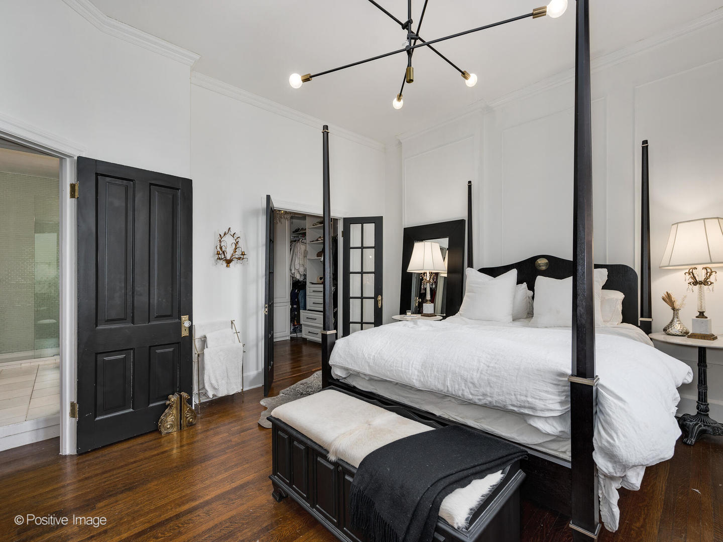 1450 North Dearborn Street, Unit 3A Chicago, IL 60610 - Photo 12 of 17 a bedroom with a bed and wooden floor