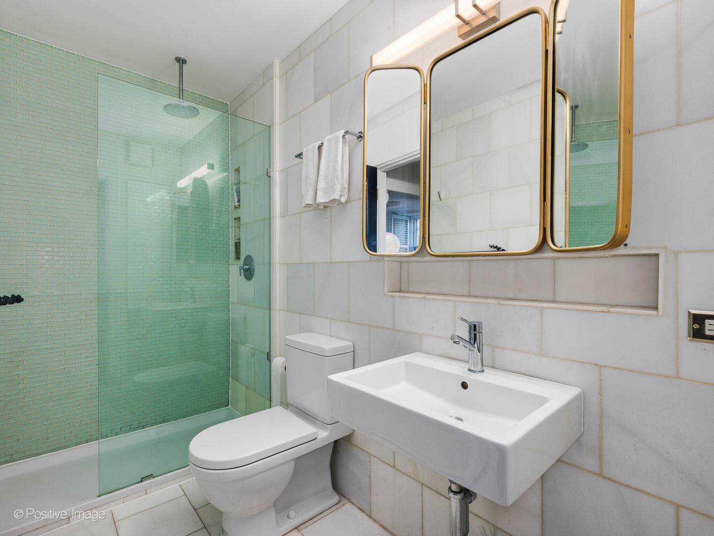 1450 North Dearborn Street, Unit 3A Chicago, IL 60610 - Photo 13 of 17 a bathroom with a sink toilet and shower