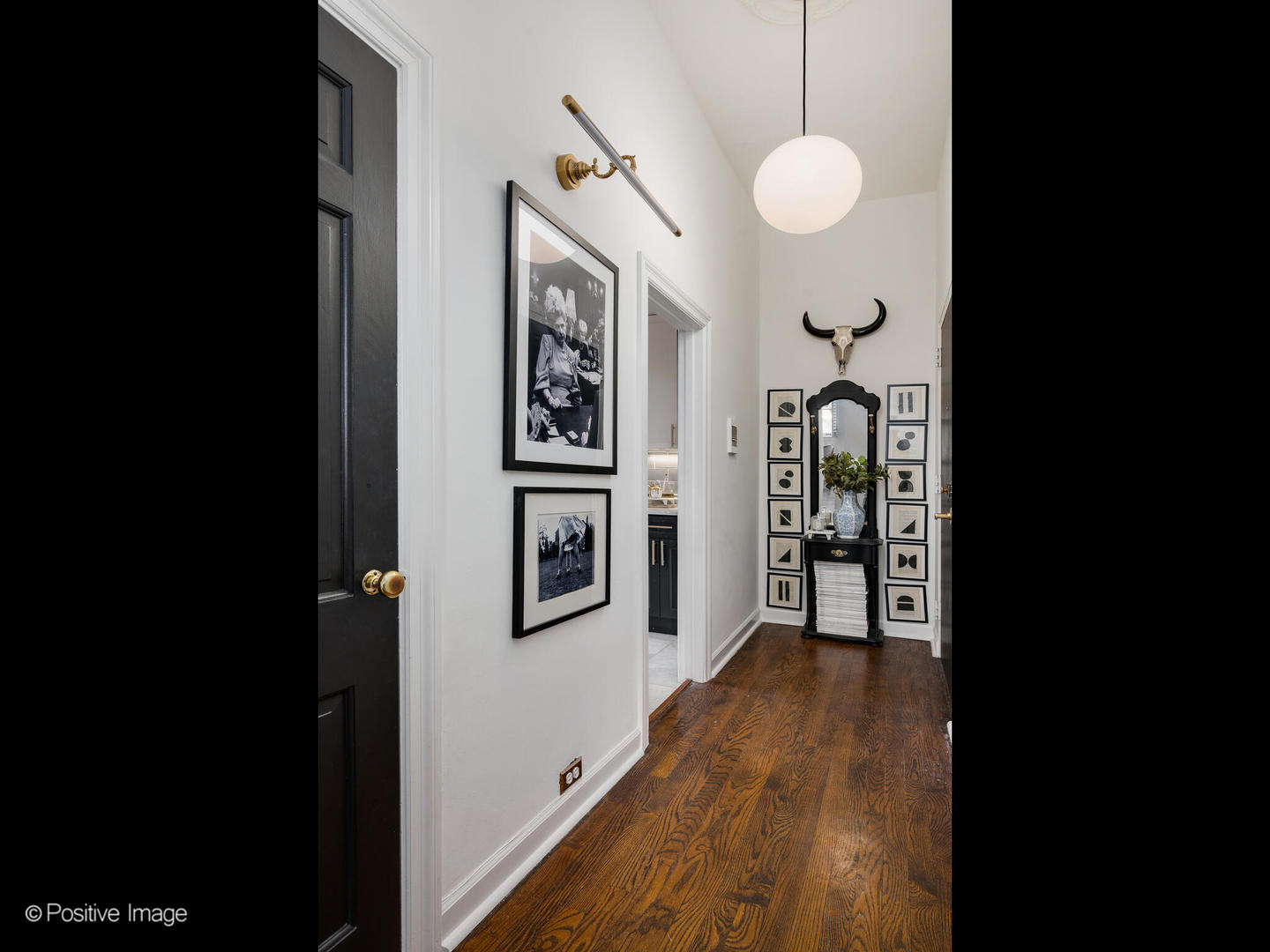1450 North Dearborn Street, Unit 3A Chicago, IL 60610 - Photo 15 of 17 a view of a hallway with wooden floor and staircase