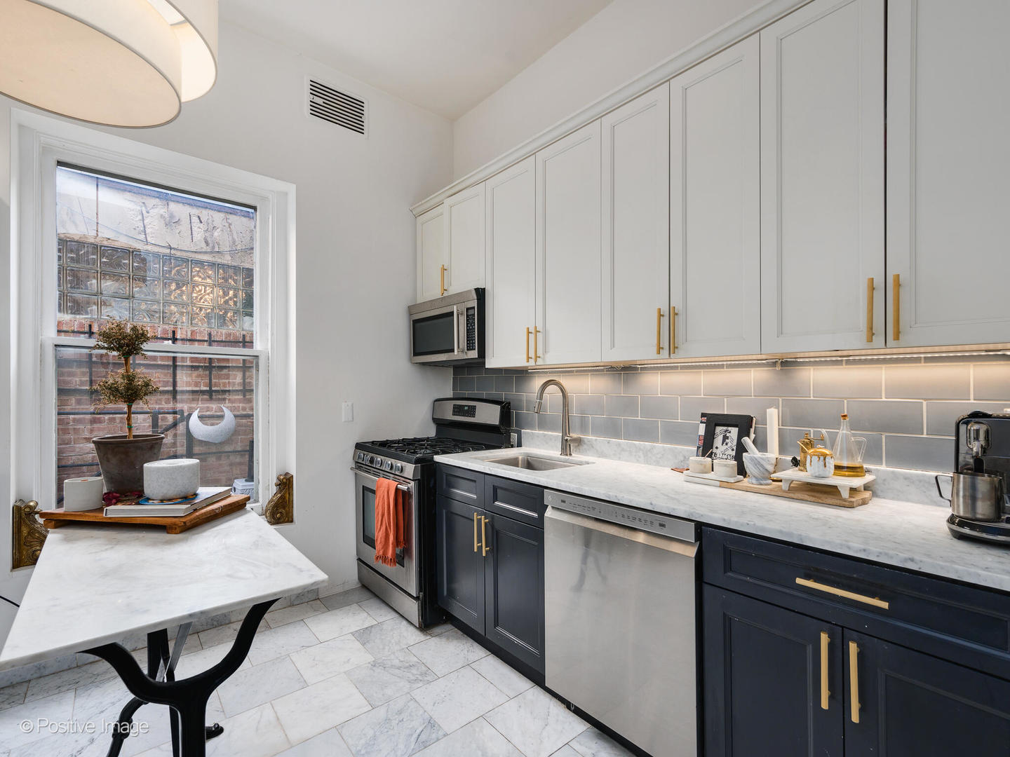 1450 North Dearborn Street, Unit 3A Chicago, IL 60610 - Photo 8 of 17 a kitchen with a sink a stove and cabinets