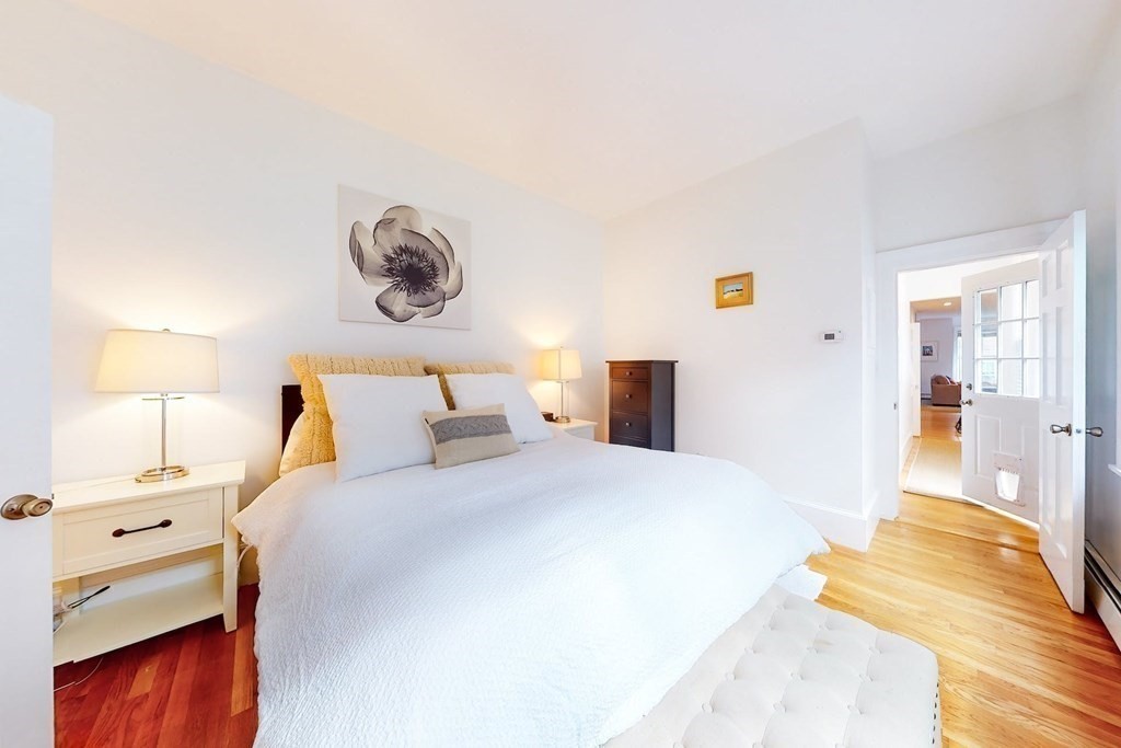 32 Mead Boston Ma, Unit 2 Boston, MA 02129 - Photo 12 of 21 a bedroom with a bed and wooden floor