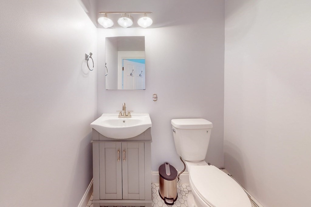 32 Mead Boston Ma, Unit 2 Boston, MA 02129 - Photo 14 of 21 a bathroom with a toilet a sink and mirror