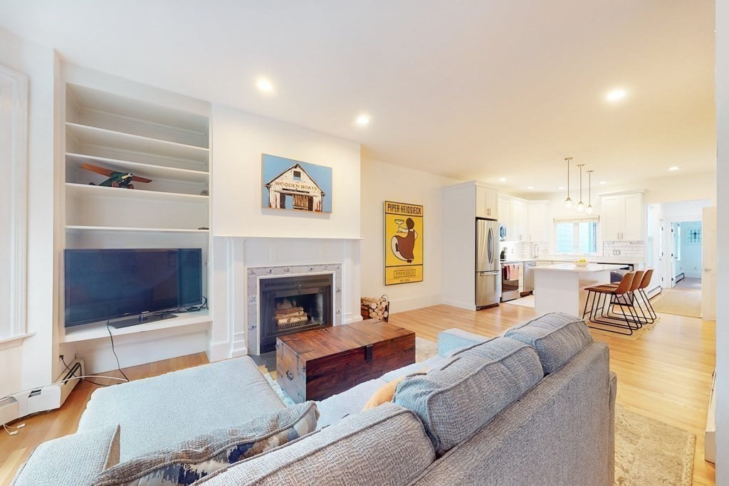 32 Mead Boston Ma, Unit 2 Boston, MA 02129 - Photo 2 of 21 a living room with furniture and a fireplace