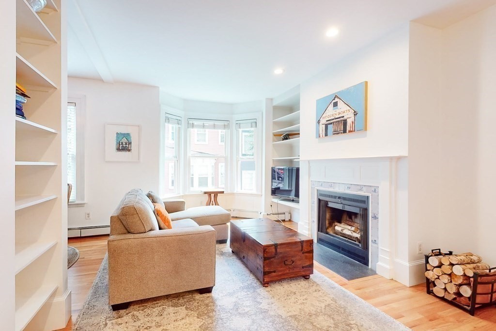 32 Mead Boston Ma, Unit 2 Boston, MA 02129 - Photo 4 of 21 a living room with furniture and a fireplace