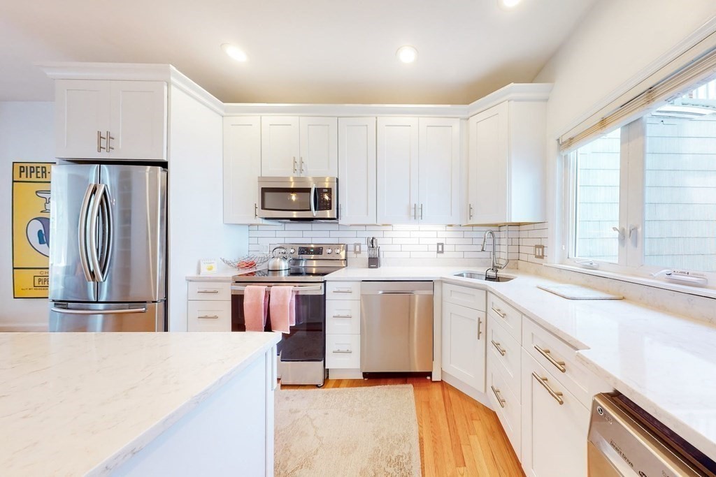 32 Mead Boston Ma, Unit 2 Boston, MA 02129 - Photo 9 of 21 a kitchen with stainless steel appliances granite countertop a refrigerator sink and stove