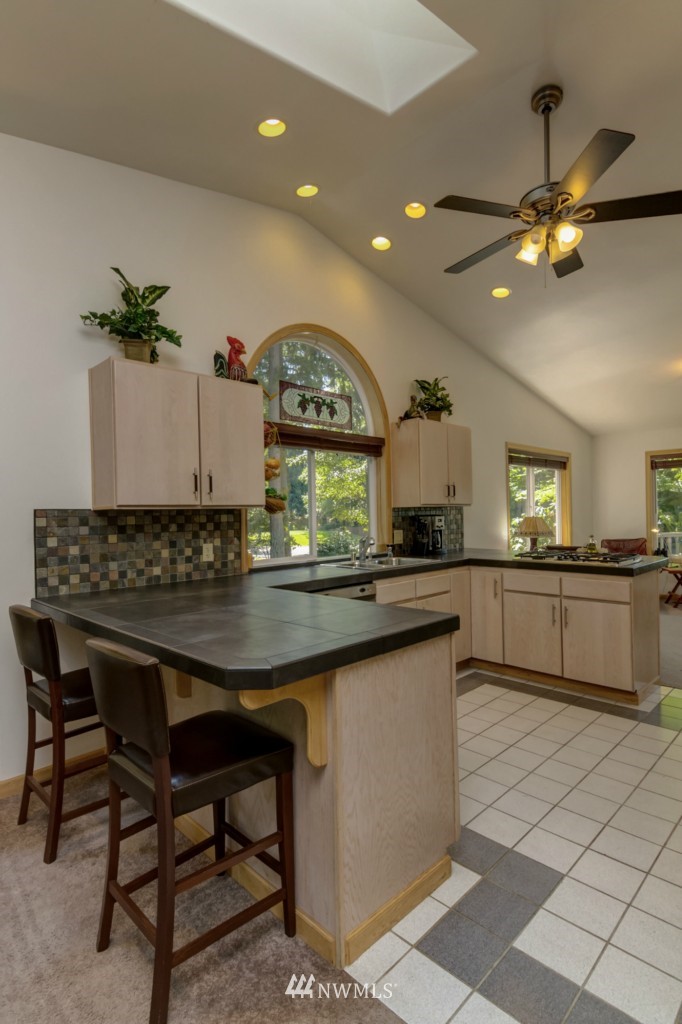 5500 Canvasback Road Blaine, WA 98230 - Photo 12 of 23 a kitchen with a table and chairs in it