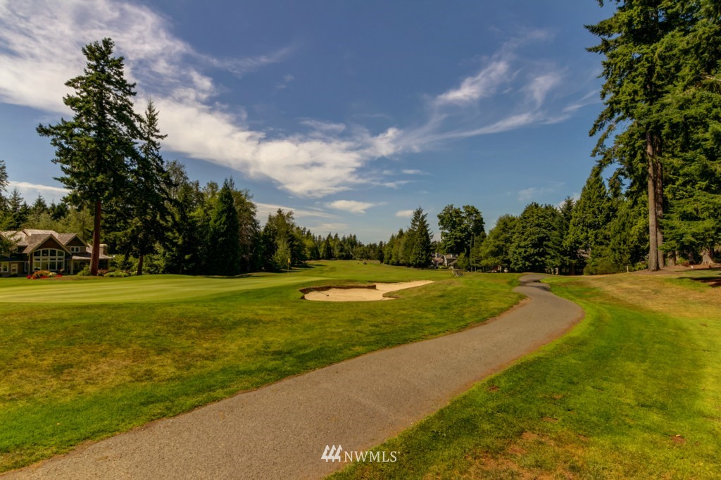 5500 Canvasback Road Blaine, WA 98230 - Photo 20 of 23 a view of a golf course with a lake