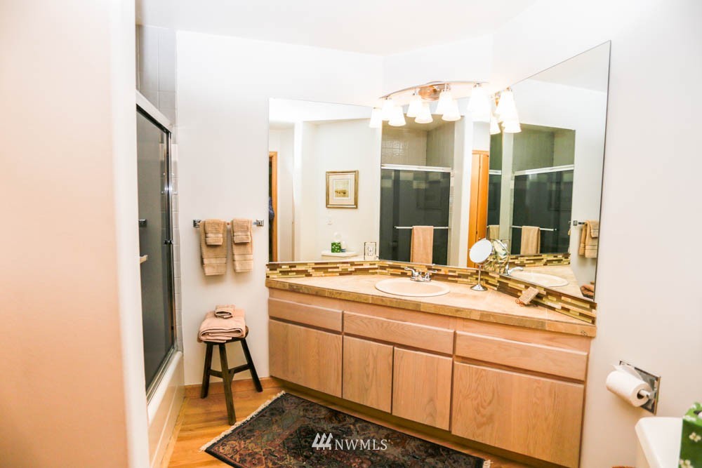 5500 Canvasback Road Blaine, WA 98230 - Photo 21 of 23 a bathroom with a sink a vanity and a mirror