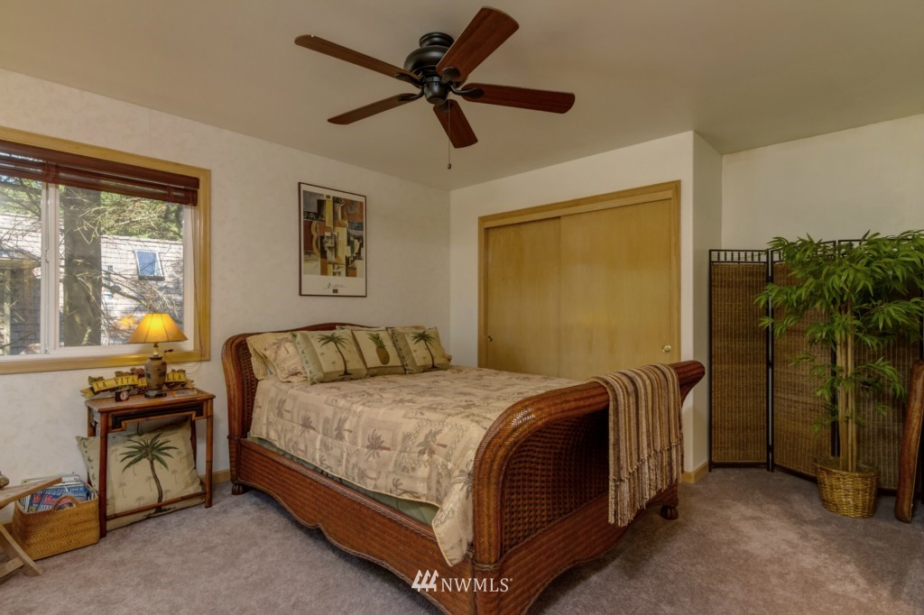 5500 Canvasback Road Blaine, WA 98230 - Photo 9 of 23 a bedroom with a bed and a chandelier