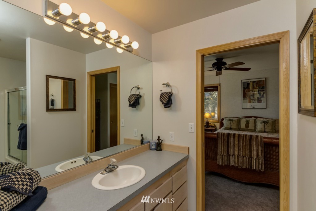 5500 Canvasback Road Blaine, WA 98230 - Photo 10 of 23 a en suite bathroom with a sink double vanity granite and a mirror