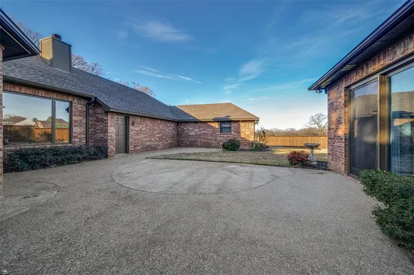 a view of a house with a yard and garage