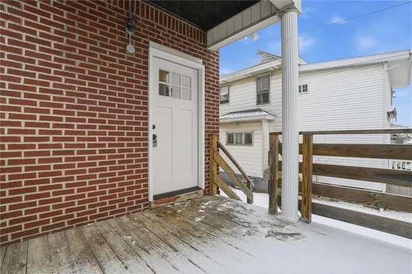 a view of a house with wooden walls