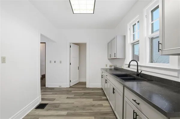 a kitchen with a sink and cabinets