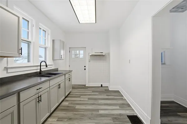 a spacious bathroom with a double vanity sink and a mirror