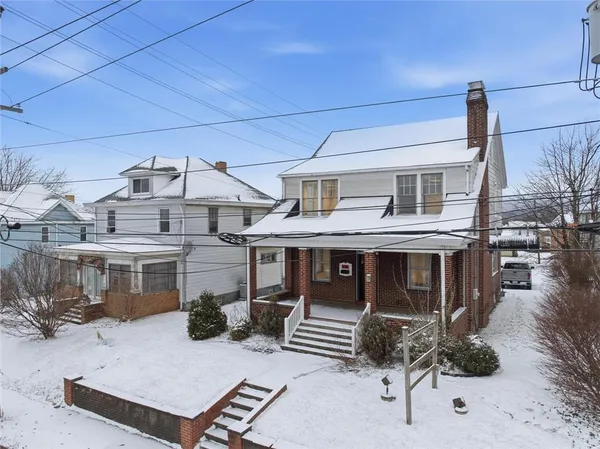 a front view of a house with yard