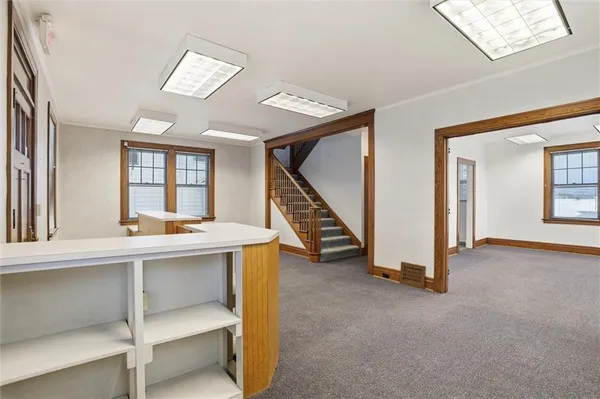 a view of entryway and hall with a window