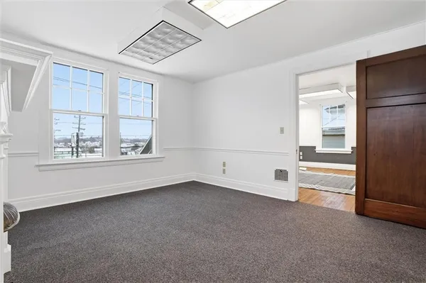 a view of an empty room with a window