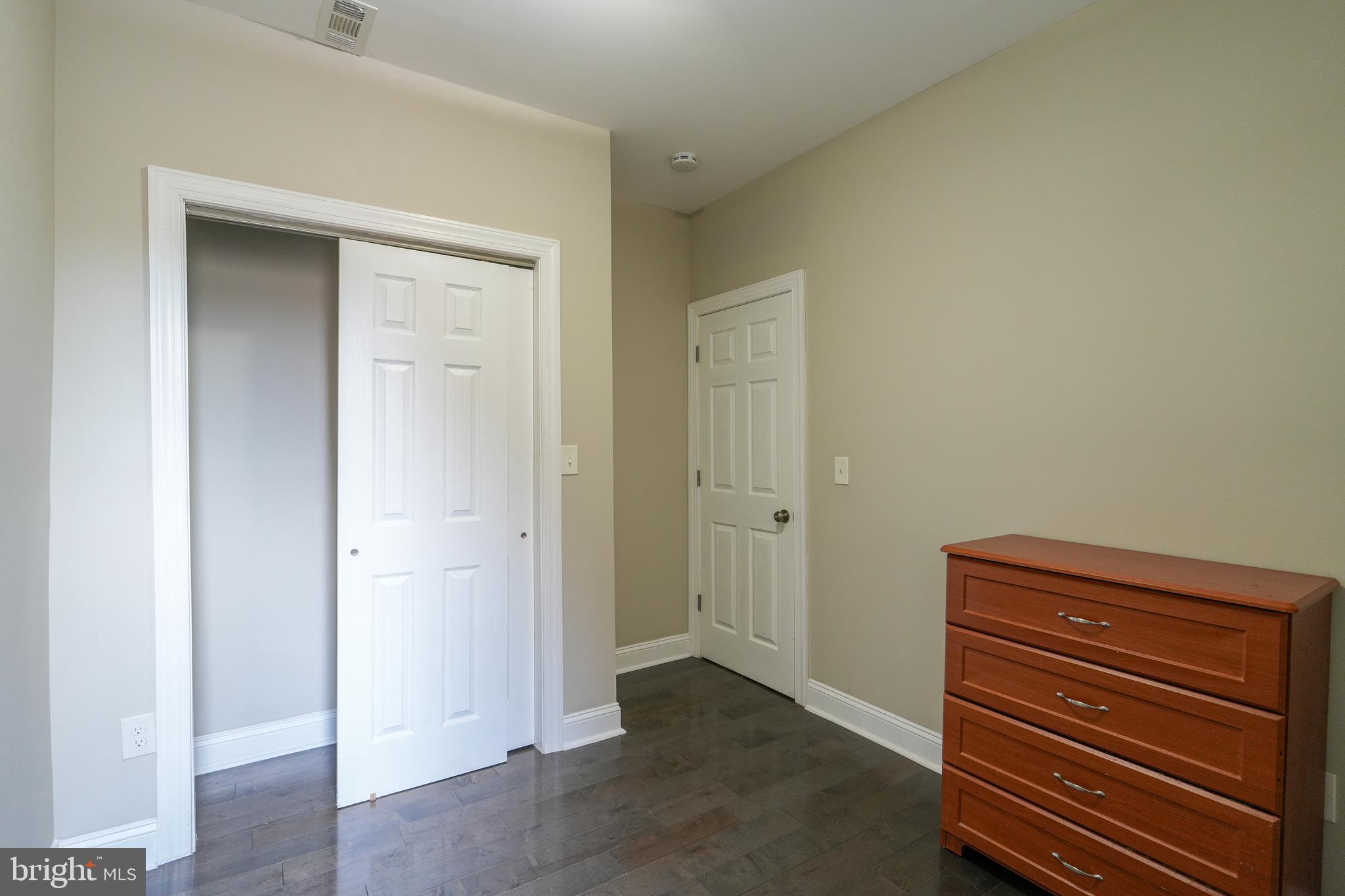 2633 Tasker Street Philadelphia, PA 19145 - Photo 16 of 23 an empty room with wooden floor
