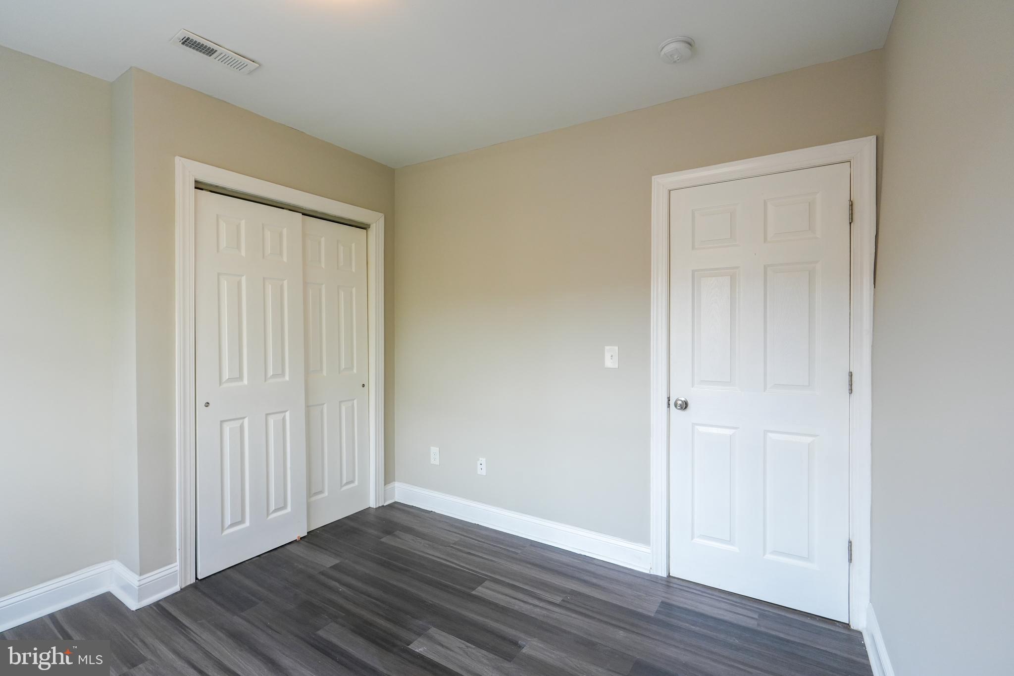 2633 Tasker Street Philadelphia, PA 19145 - Photo 19 of 23 a view of an empty room with wooden floor