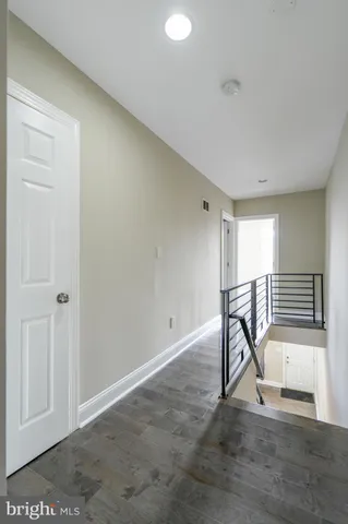 a view of a room with a table and chairs